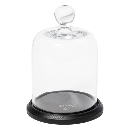 Trudon La Cloche hand-blown glass bell jar with wooden base over a Classic Candle